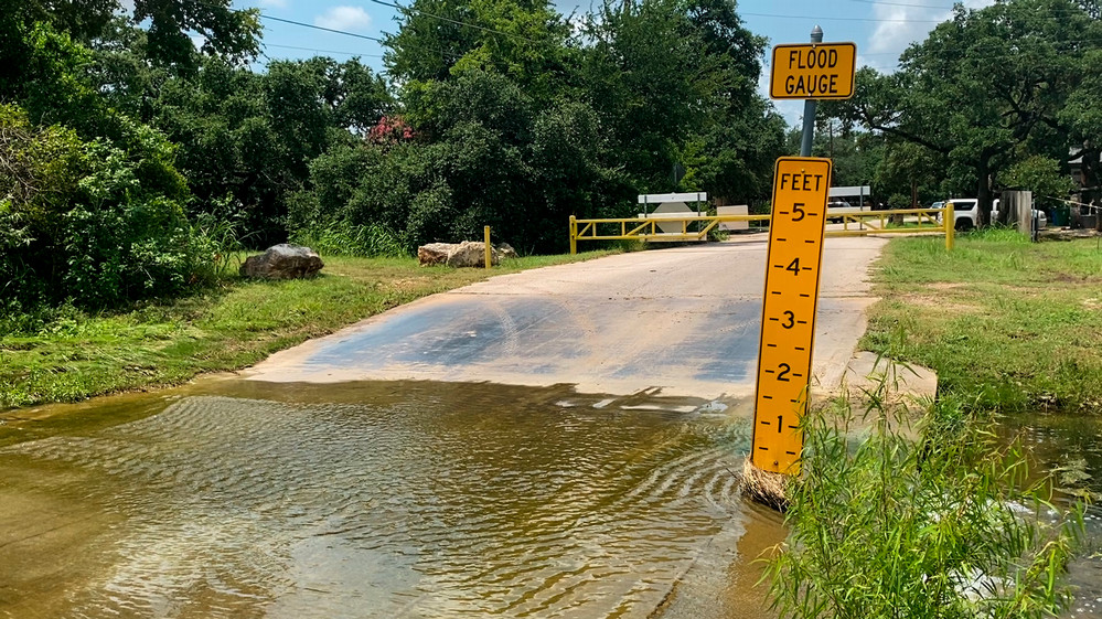 A flooded roadway in Travis County