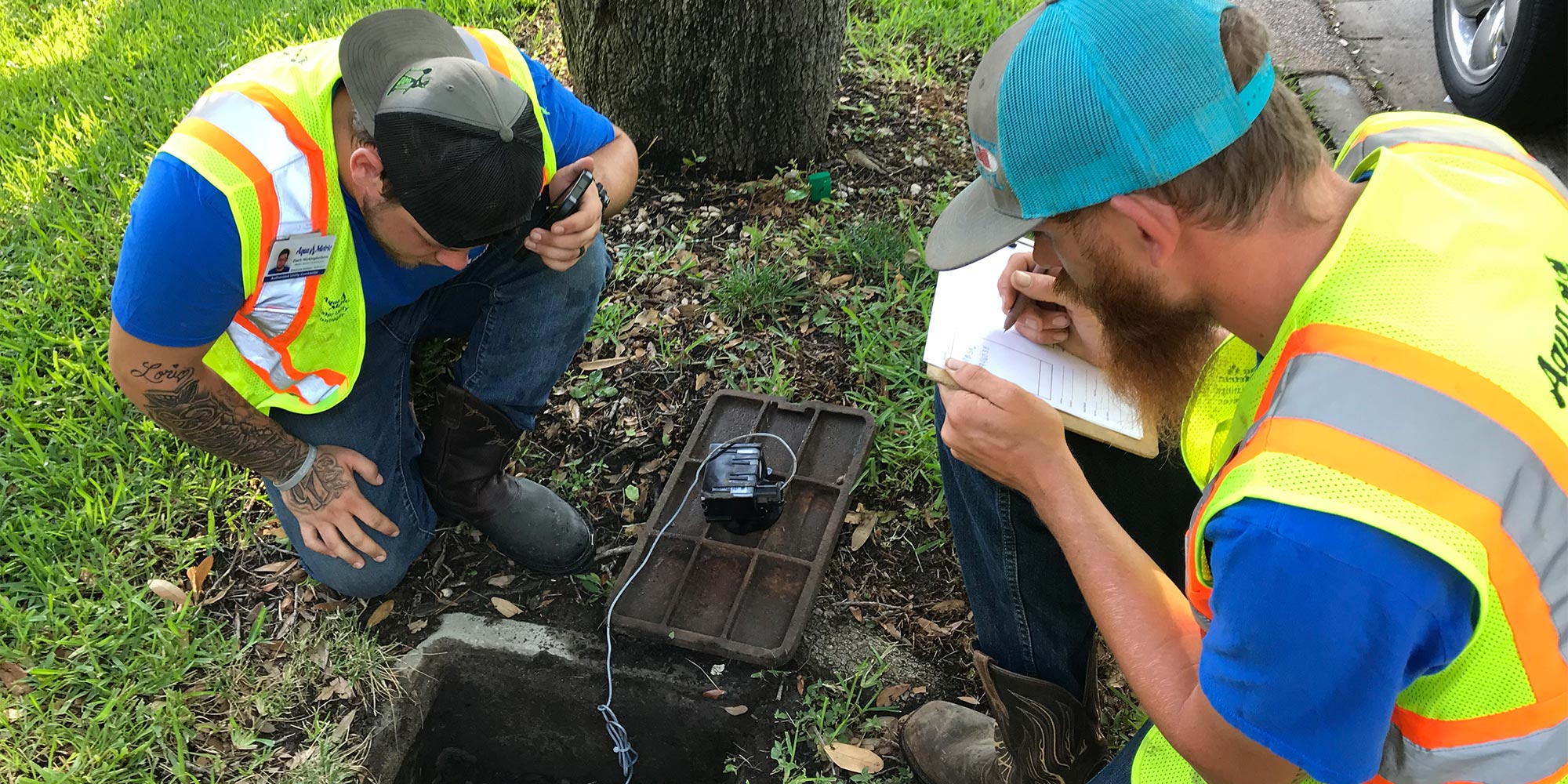 Water utility employees evaluate a water meter. Photo courtesy of the City of Fort Worth Water Department.